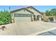 Lovely home featuring a two-car garage, low maintenance gravel yard, and covered entryway at 2101 S Meridian Rd # 250, Apache Junction, AZ 85120