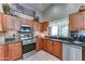 Spacious kitchen featuring stainless steel appliances, granite countertops, and custom cabinetry at 2101 S Meridian Rd # 250, Apache Junction, AZ 85120