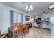 Inviting living room with a dining table, tile floors, and plenty of natural light from a large window at 2101 S Meridian Rd # 250, Apache Junction, AZ 85120