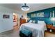 Comfortable bedroom with a decorative teal wall shelf and attached bath with vanity sink at 2101 S Meridian Rd # 250, Apache Junction, AZ 85120