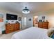 Bright bedroom leading to a full bath, dresser, and closet space for plenty of storage at 2101 S Meridian Rd # 250, Apache Junction, AZ 85120
