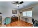 Bright office space with hardwood floors, a ceiling fan, and a large window at 2101 S Meridian Rd # 250, Apache Junction, AZ 85120