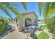 Outdoor patio area with comfortable seating and a view of the landscaped yard at 2101 S Meridian Rd # 250, Apache Junction, AZ 85120