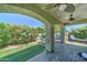 Covered patio with brick flooring and comfortable seating area, perfect for relaxing at 2101 S Meridian Rd # 250, Apache Junction, AZ 85120