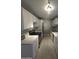 Well-lit kitchen featuring white cabinets, marble countertops, and stainless steel appliances at 2121 W Royal Palm Rd # 1014, Phoenix, AZ 85021