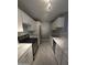 Well-lit kitchen featuring white cabinets, marble countertops, and stainless steel appliances at 2121 W Royal Palm Rd # 1014, Phoenix, AZ 85021