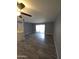 A spacious living room featuring wood floors and a sliding glass door with access to the outside at 2121 W Royal Palm Rd # 1014, Phoenix, AZ 85021