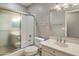 Practical bathroom with a shower-tub combo, toilet, and vanity with sink and mirror at 21675 N 61St Ave, Glendale, AZ 85308