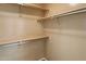 Functional closet with multiple shelves and rods providing ample storage space and organization at 21675 N 61St Ave, Glendale, AZ 85308