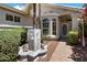 Inviting front entrance with a decorative fountain, manicured bushes, and a stylish front door for added curb appeal at 21675 N 61St Ave, Glendale, AZ 85308