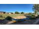 Scenic view of the golf course with lush green grass and a gently flowing creek in a residential neighborhood at 21675 N 61St Ave, Glendale, AZ 85308