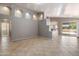 Spacious living room with tile flooring, neutral walls, and large sliding doors offering plenty of natural light at 21675 N 61St Ave, Glendale, AZ 85308