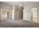 Spacious main bedroom with plush carpet, neutral walls, and large sliding doors offering plenty of natural light at 21675 N 61St Ave, Glendale, AZ 85308