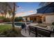 Expansive backyard featuring a sparkling pool, covered patio, and comfortable outdoor seating at 24121 N 24Th Pl, Phoenix, AZ 85024