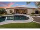 Backyard pool with covered patio and outdoor kitchen at 24121 N 24Th Pl, Phoenix, AZ 85024