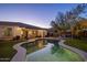 Backyard view with pool, putting green, covered patio, and various seating areas for enjoying outdoors at 24121 N 24Th Pl, Phoenix, AZ 85024