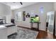 Well-lit bedroom with wood floors, built-in shelves, and modern decor at 24121 N 24Th Pl, Phoenix, AZ 85024