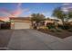 Charming single-story home with a two-car garage, manicured landscaping, and well-maintained driveway at 24121 N 24Th Pl, Phoenix, AZ 85024