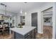 Modern kitchen island with gray cabinetry and bright white countertop, perfect for food preparation and casual dining at 24121 N 24Th Pl, Phoenix, AZ 85024