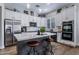 Elegant kitchen featuring stainless steel appliances, white cabinetry, and a convenient center island at 24121 N 24Th Pl, Phoenix, AZ 85024