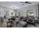 Spacious living and dining area with oversized sofa and ample natural light at 24121 N 24Th Pl, Phoenix, AZ 85024