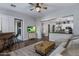 Spacious living room with bar seating, television and view into the kitchen, creating an inviting and open floorplan at 24121 N 24Th Pl, Phoenix, AZ 85024