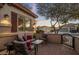 Picturesque patio with comfortable seating, beautiful landscaping and a view of neighboring homes at 24121 N 24Th Pl, Phoenix, AZ 85024