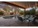 Covered patio with seating overlooking the pool and backyard at 24121 N 24Th Pl, Phoenix, AZ 85024