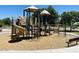 Community playground with slides, ladders, and swings at 24121 N 24Th Pl, Phoenix, AZ 85024