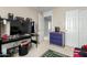 Cozy bedroom featuring a desk and entertainment center, and neutral paint at 2543 N 73Rd Dr, Phoenix, AZ 85035