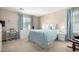 Calming bedroom featuring a bed, desk, carpeted floors, and soft natural light at 2543 N 73Rd Dr, Phoenix, AZ 85035