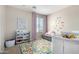 Cheerful Bedroom with soft purple accents, alphabet decorations, and playful elements at 2543 N 73Rd Dr, Phoenix, AZ 85035