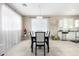 Bright dining room with modern chandelier, seating for six, and seamless flow to the kitchen at 2543 N 73Rd Dr, Phoenix, AZ 85035