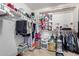 Organized walk-in closet with ample storage including shelves, rods, and floor space at 2543 N 73Rd Dr, Phoenix, AZ 85035