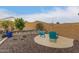 Cozy backyard area with chairs and a fire pit at 25955 W Deer Valley Rd, Buckeye, AZ 85396