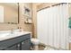 A well-lit bathroom with a stylish gray vanity and shower at 25955 W Deer Valley Rd, Buckeye, AZ 85396