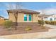 Charming single-story home with desert landscaping, a tile roof, and a neutral color scheme at 25955 W Deer Valley Rd, Buckeye, AZ 85396