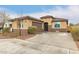 Single-story home with a neutral stucco exterior, tile roof, and well-maintained front yard at 25955 W Deer Valley Rd, Buckeye, AZ 85396