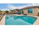 Inviting backyard pool with lounge furniture and outdoor seating at 25955 W Deer Valley Rd, Buckeye, AZ 85396