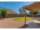 Large backyard area, with a gravel pit and grass at 321 W Betsy Ln, Gilbert, AZ 85233