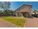Spacious backyard featuring a covered patio, verdant lawn, and meticulously crafted border, enhancing the property's outdoor appeal at 321 W Betsy Ln, Gilbert, AZ 85233