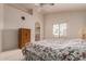 Bright bedroom with floral comforter and natural lighting at 321 W Betsy Ln, Gilbert, AZ 85233