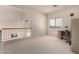 Upstairs bonus room featuring lots of space, a window and a ceiling fan at 321 W Betsy Ln, Gilbert, AZ 85233