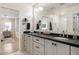 Bright bathroom featuring dual vanities, modern fixtures, and a large mirror at 3308 N 51St St, Phoenix, AZ 85018