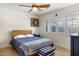 Comfortable bedroom with wooden floors, white walls, and plantation shutters at 3308 N 51St St, Phoenix, AZ 85018