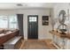 Inviting entryway with stylish decor, wood floors, and a charming rustic console table at 3308 N 51St St, Phoenix, AZ 85018