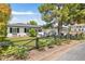 Attractive single-story home featuring a well-kept lawn, charming fence and shade tree at 3308 N 51St St, Phoenix, AZ 85018