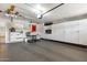 Well-organized garage with ample storage cabinets and shelving, perfect for parking and hobbies at 3308 N 51St St, Phoenix, AZ 85018