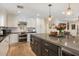 Spacious kitchen featuring white cabinets, a large island, and stainless steel appliances at 3308 N 51St St, Phoenix, AZ 85018