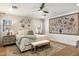 Serene main bedroom with hardwood floors, a ceiling fan, and plenty of natural light at 3308 N 51St St, Phoenix, AZ 85018